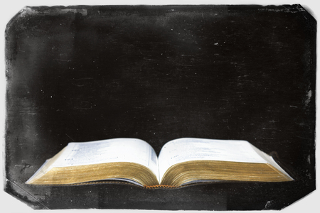 Vintage Retro Photography of a Bible in a Dark Room with Scratch Marks, Distressed Texture and a...