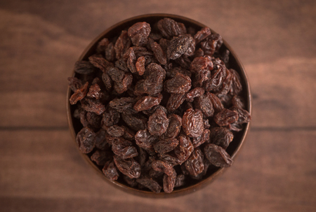 Raisins in a Wooden Bowlの写真素材