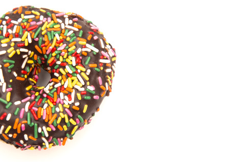 Chocolate Sprinkle Donuts on a White Backgroundの写真素材