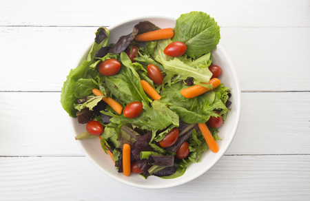 Bowl of Healthy Salad with Carrots and Tomatoesの写真素材