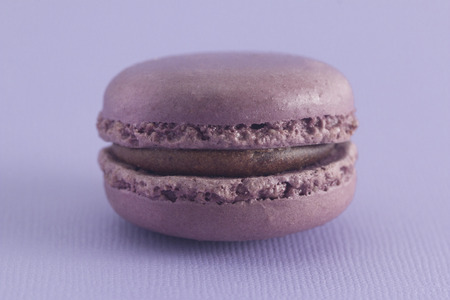Purple French Macarons on a Purple Backgroundの写真素材