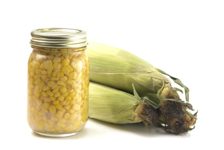 Corn Canned in a Home Canning Jar on a White Backgroundの写真素材