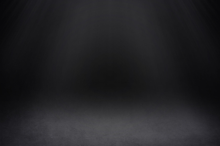 Dark Background with a Spotlight in the Centerの写真素材