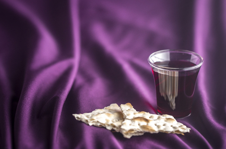 Christian Communion on a Purple Fabic Backgroundの写真素材