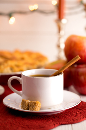 Hot Apple Cider with an Apple Pie and Cinnamon Stickの写真素材