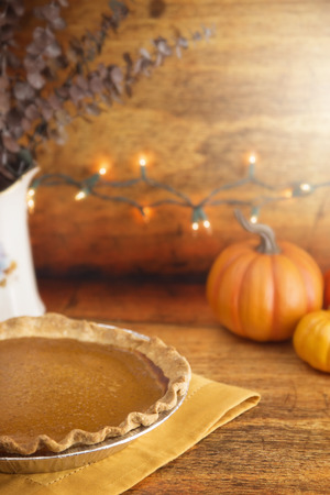 Pumpkin Pie on a Kitchen Counter with Lightsの写真素材