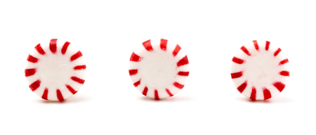 Three Round Peppermints on a White Backgroundの写真素材