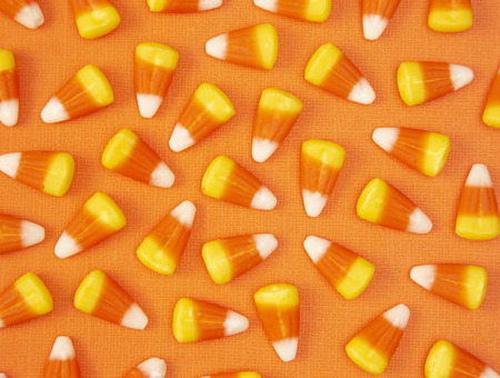 Halloween Candy Background on an Orange Surfaceの写真素材