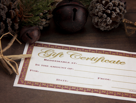 Blank Gift Voucher on a Wooden Tableの写真素材