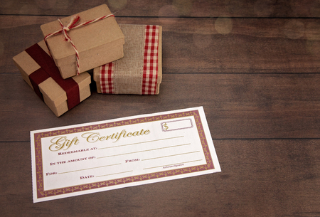 Blank Gift Voucher on a Wooden Tableの写真素材