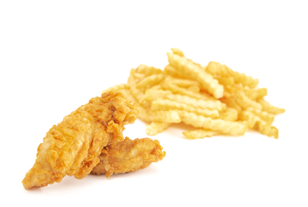 Chicken Fingers and Crinkle French Fries on a White Backgroundの写真素材