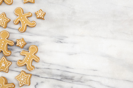 A Background of Holiday Gingerbread Cookies on a Marble Counter
