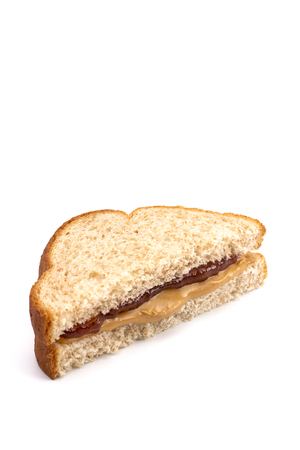 Classic Peanut Butter and Strawberry Jelly Sandwich on Wheat Breadの写真素材