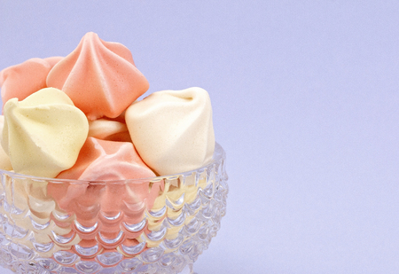 A Crystal Dessert Bowl Filled with Various Colored Meringuesの写真素材
