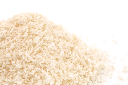 Raw Organic Unsweetened Coconut on a White Backgroundの写真素材