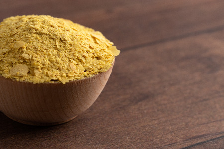 Flakes of Yellow Nutritional Yeast a Cheese Substitute and Seasoning for Vegan Cooking