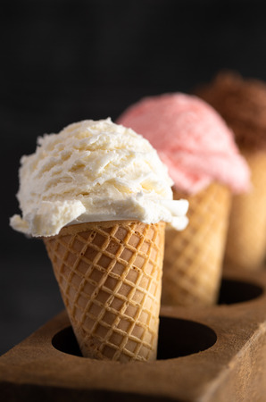 Line of Three Classic Flavors of Ice Cream in a Wooden Sugar Moldの写真素材