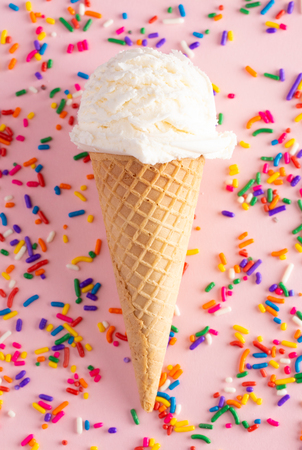 A Scoop of Vanilla Ice Cream in a Waffle Coneの写真素材