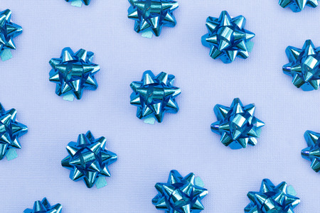 A Background with Repeating Pattern of Bows and Ribbons