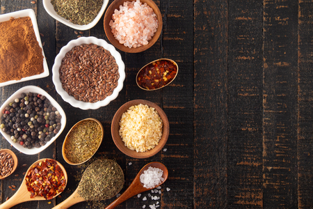 A Collage of Various Seasonings Spices and Herbs for Flavorful Cooking and Bakingの写真素材