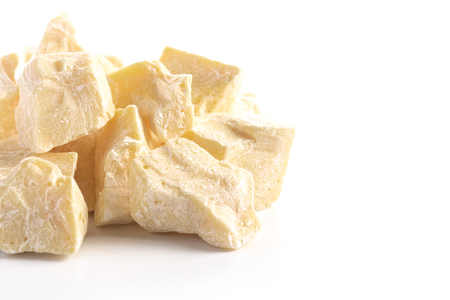 Chunks of Raw Organic Cocoa Butter Isolated on a White Backgroundの写真素材