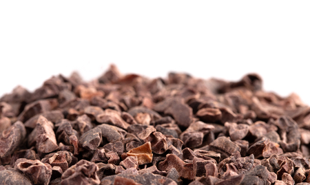 A Pile of Raw Chocolate Nibs on a White Backgroundの写真素材