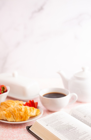 Personal Bible Study at a Table Set for Breakfastの写真素材