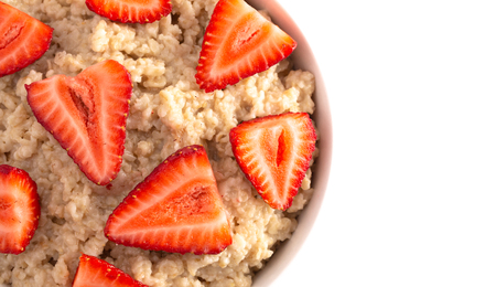 Oatmeal with Strawberries Isolated on a White Background