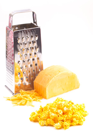 Pile of Extra Cheese Yellow Popcorn on a White Backgroundの写真素材