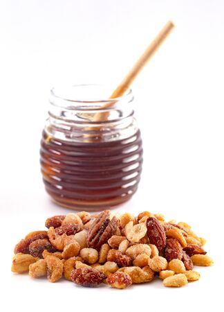 Mixed Honey Roasted Nuts Isolated on a White Backgroundの写真素材