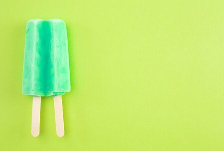 Teal ice on a Bright Green Backgroundの写真素材