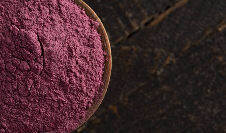 Bright Colored Acai Berry Powder Perfect for Adding to Recipes like Smoothiesの写真素材