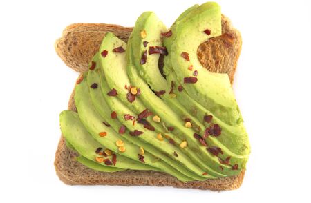 Hot and Spicy Avocado Toast with Toppings Isolated on a White Backgroundの写真素材