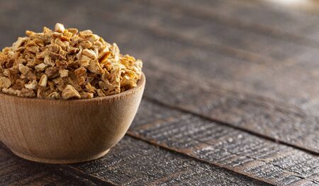 Dehydrated Lemon Peel on a Rustic Wooden Tableの写真素材