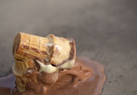 An Ice Cream Cone Knocked Over and Melting の写真素材