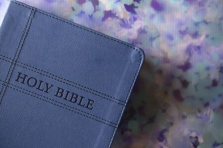 The Holy Bible on a Rustic Wooden Tableの写真素材