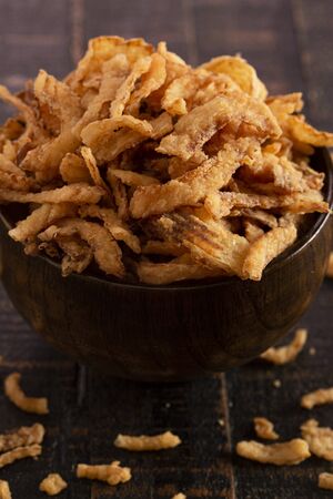 Fried Onions for Green Bean Casserole or Salad Garnish on a Rustic Wooden Tableの写真素材