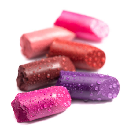Six cut tube of lipstick on whiteの写真素材
