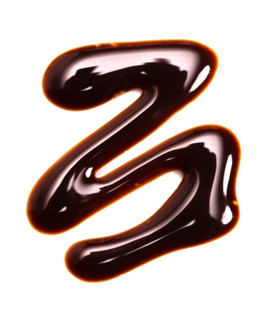 A Swirl of Chocolate Sauce Isolated on a White Backgroundの写真素材