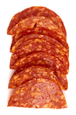 Slices of Spicy Calabrese Salami Meat Isolated on a White Backgroundの写真素材
