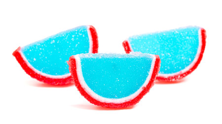 Blue and Red Candy Fruit Slice Isolated on a White Backgroundの写真素材