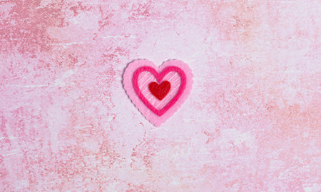 Simple Background with Felt Love Hearts on a Pink Background