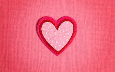 Simple Background with Felt Love Hearts on a Pink Background