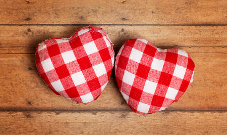 Plaid Love Hearts on a Rustic Wooden Backgroundの写真素材
