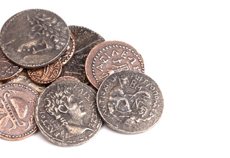 A Pile of Ancient Roman Coin Replicas  Isolated on a White Backgroundの写真素材