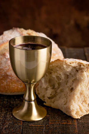 The Sacrament of Holy Communion  on a Dark Wooden Tableの写真素材