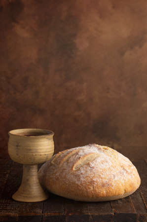The Sacrament of Holy Communion  on a Dark Wooden Tableの写真素材