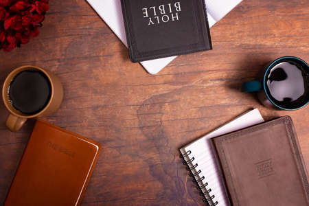 Group Bible Study with Hot Coffee on a Distressed Red Wood Tableの写真素材