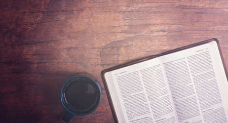 Personal Bible Study with Hot Coffee on a Distressed Red Wood Tableの写真素材