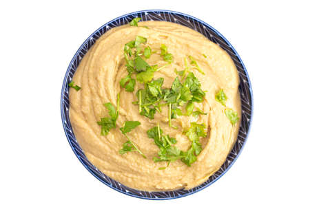 A Bowl of Fresh Hummus on a White Backgroundの写真素材